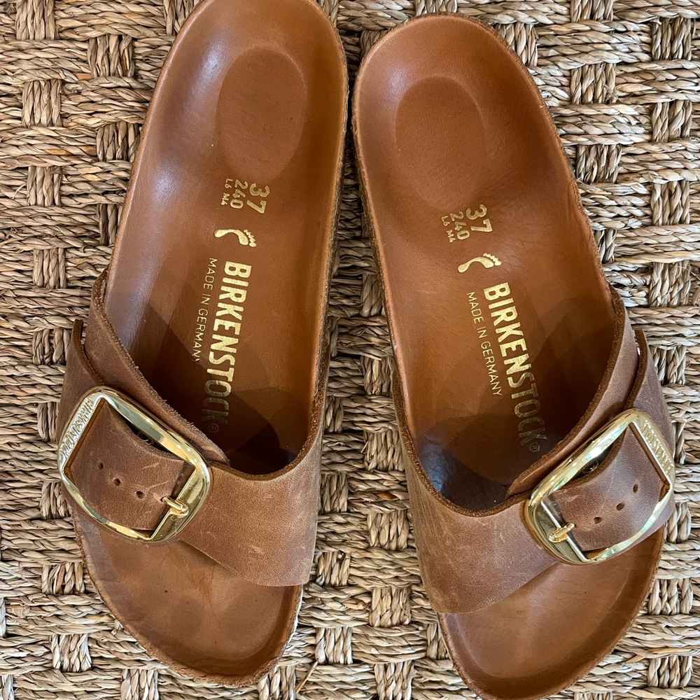 Birkenstocks one strap brown with large gold buckle